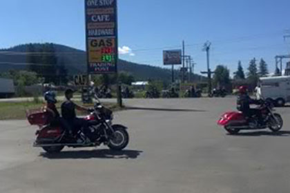 Some riders on their motorcycles.