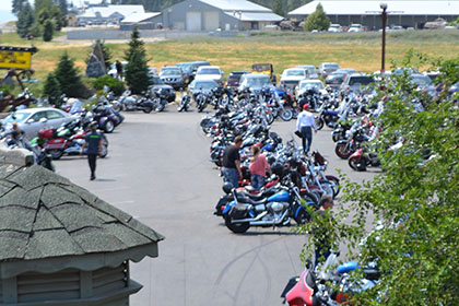 Motorcycles fill the parking lot at the event.