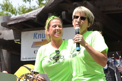Couple Ride for Life committee members on stage at the event.