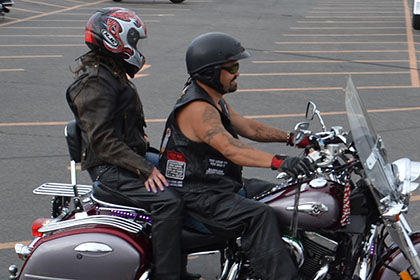 Two people on a motorcycle.